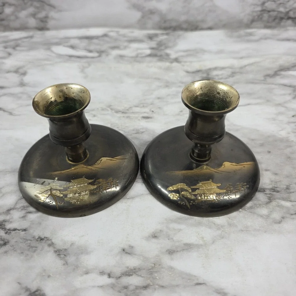 Vtg Pair Japanese brass bud vases featuring an etched pagoda and mountain scene